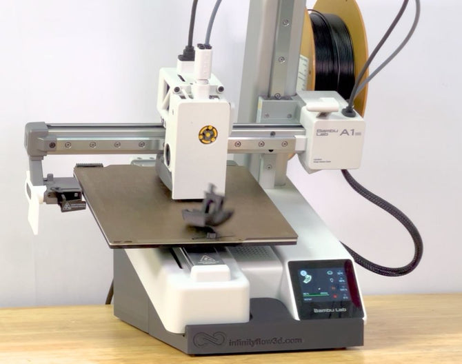 The bambu A1 mini removing a print automatically using the free infinity flow auto clearing tilt kit